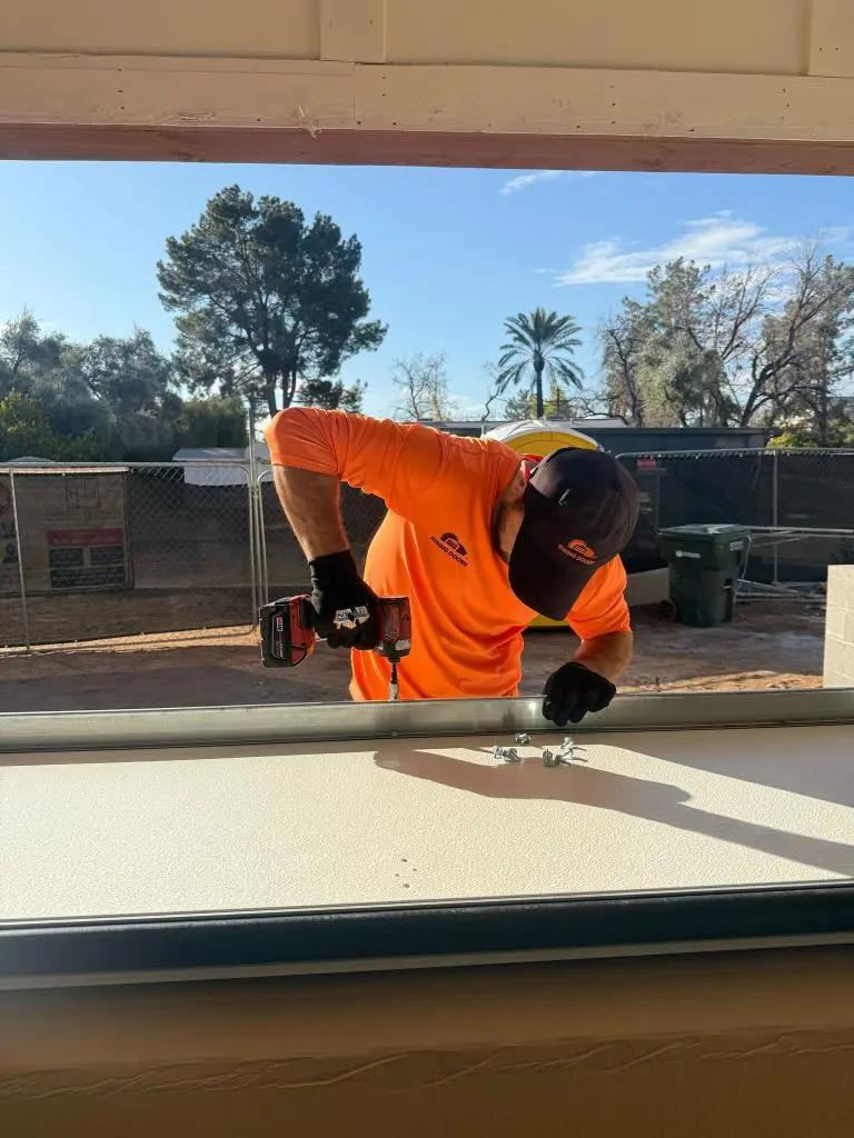 Technician performing Garage Door Fix on broken garage door spring system