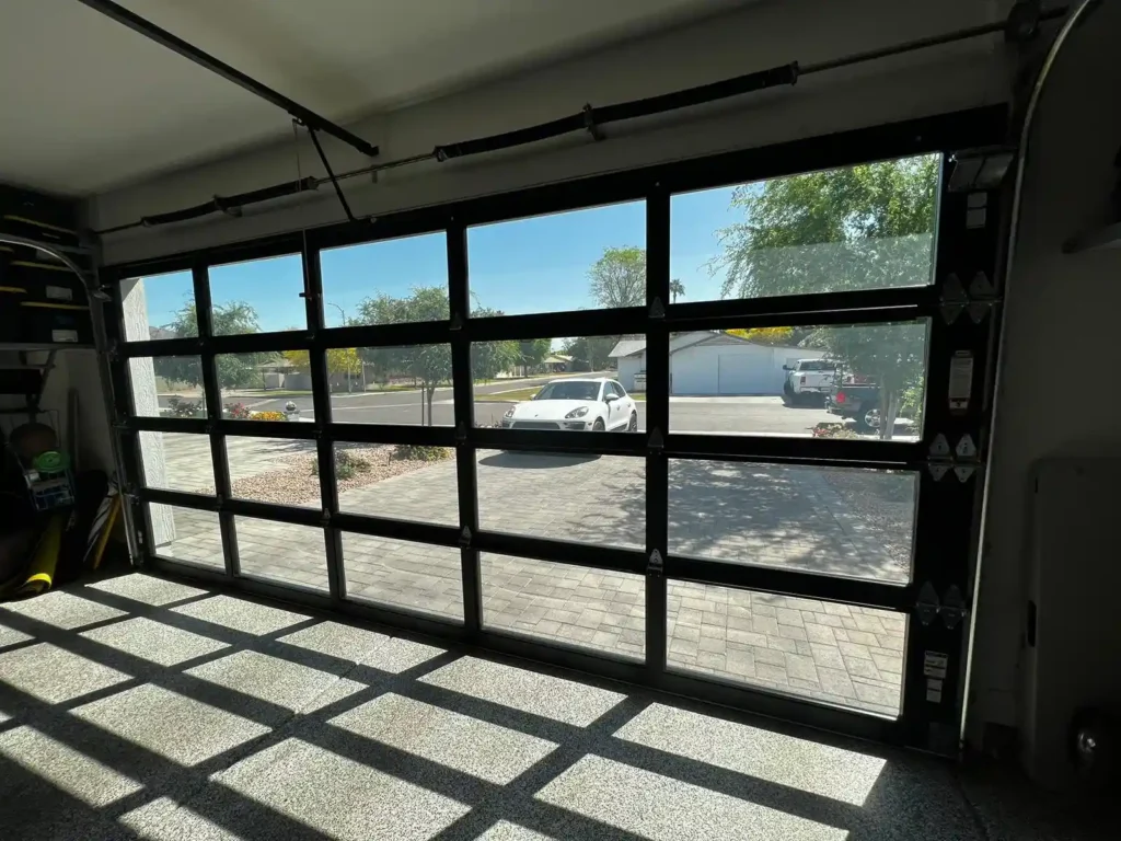 Garage Door Repair in Peoria specialist troubleshooting automatic opener system in a Peoria suburban home garage